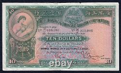 Billet de banque de dix dollars de Hong Kong de 1958 avec J 910,980